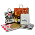 Image of various sized handled paper shopping bags.